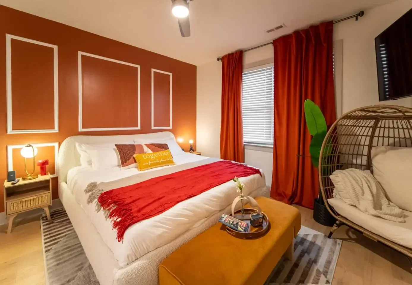 Bedroom with bold accent wall and lounge chair